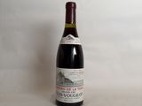 a bottle of wine that is sitting on a table