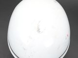 an image of a white ball on a black surface