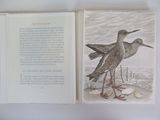 a book with a picture of two birds on it