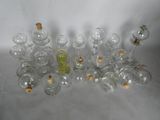 a lot of empty glass bottles with corks on them