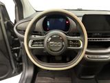 the interior of a car with a steering wheel and dashboard controls