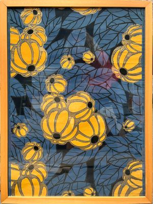 painting of yellow and black flowers in a yellow frame on a blue background