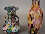 two vases sitting next to each other on a table