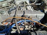 a car engine with a lot of wires attached to it