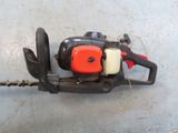 a chainsaw that is sitting on the ground