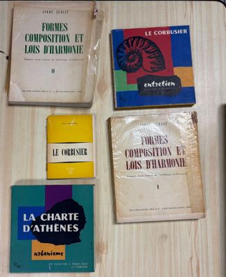 several books are sitting on a table next to each other