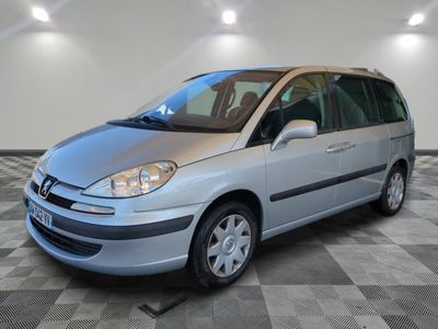 a picture of a silver car parked in a garage