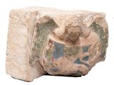 a stone sculpture of an angel with wings on it ' s head