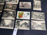 many old postcards with pictures on them on a table