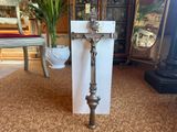a cross that is sitting on the floor in front of a door