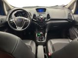 the interior of a car with a steering wheel, dashboard, and dashboard controls