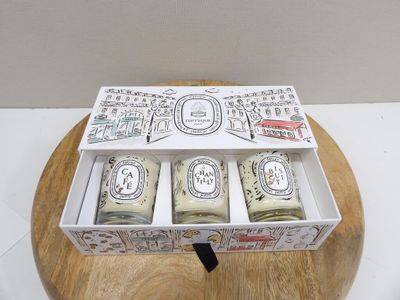 three soap bars in a box on a wooden stand