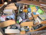 a box full of assorted electronics and other items