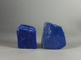 pair of blue lapis stone stud earrings on a white background