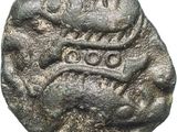 a silver coin with a snake on it