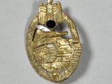 an image of a gold badge with a bird on it