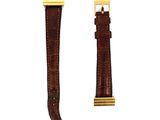 a close up of a watch strap on a white background