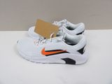 a pair of white and orange sneakers with a tag on them