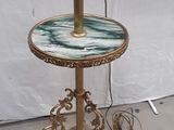 a lamp that is on a table with a marble top
