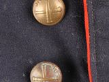 a close up of a jacket with two buttons on it