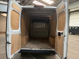 a white van that is parked inside of a building