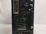 a black computer tower with a keyboard on top of it