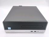 the front view of a desktop computer on a white surface