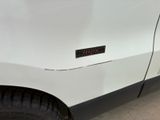 a white truck with a sticker on the side of it