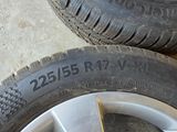 tire treads and rims of a car in a garage