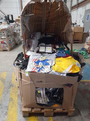 a cardboard box filled with assorted items in a warehouse