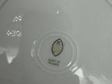a white plate with a picture of a penguin on it