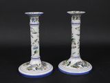 pair of blue and white vases with birds and flowers on them