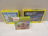 three children ' s board games are sitting on a table