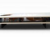 a white coffee table with a glass top on a white background