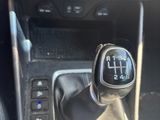 a close up of a car ' s gear lever in the center console