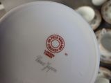 a white plate with a red and white design on it