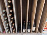 many bottles of wine sitting in a wine rack