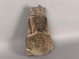 a close up of a statue of a woman with a crown on her head
