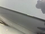 a close up of a car ' s door handle with a shadow of a flower on it
