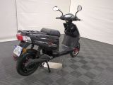 a scooter that is parked in a room