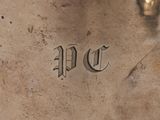a close up of a metal object with a writing on it