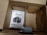 a box with a camera inside of it on a table