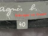 an image of a label on a black jacket that says agnes b