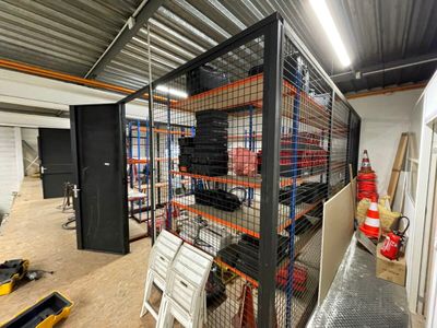 a room that has a lot of shelves and chairs in it