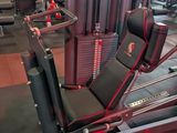 a gym room with a row of machines in it