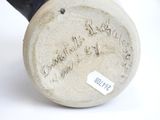 a close up of a vase with a label on it