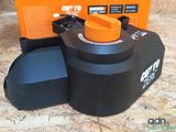 a black and orange machine with a box on the table