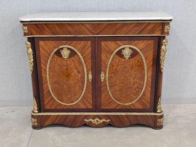 a wooden cabinet with two doors and a marble top
