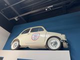 a small car that is on display on the wall