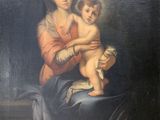 an old painting of a woman holding a baby in her lap